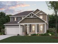 Charming two-story home with a welcoming front porch, well-manicured lawn, and an attached two-car garage at 777 Ruddy Drive (Lot20), Grayson, GA 30017