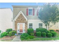Charming two-story home with brick and shake siding, plus a well-manicured front yard with lush landscaping at 3134 Imperial Sw Cir, Atlanta, GA 30311