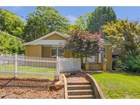 Charming bungalow with a white picket fence and a well-manicured lawn at 636 Cameron Street Se St, Atlanta, GA 30312
