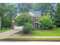 Charming two-story brick home with well-maintained landscaping and a two-car garage at 3522 Estates Landing Nw Dr, Kennesaw, GA 30144