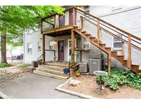 Charming two-story apartment featuring stairs leading to front door with decorative plants surrounding walkway at 40 Daniel Se St # 1, Atlanta, GA 30312
