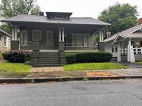 Charming home featuring a covered front porch, providing a welcoming entrance to this beautiful property at 389 Dargan Sw Pl, Atlanta, GA 30310