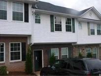 Attractive multi-level home featuring vinyl siding, brick accents, and black shutters on a cloudy day at 3604 Ginnis Sw Rd # 4, Atlanta, GA 30331