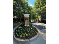 Landscaped entrance to Park Row featuring well-maintained plants and trees. Est 2004 at 1107 Park Row South Se, Atlanta, GA 30312