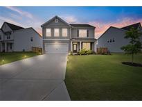 Charming two-story home with a well-manicured lawn and a two-car garage in a great neighborhood at 537 Garnet Dr, Acworth, GA 30101
