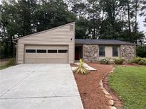 Charming single story home with stone and siding, plus large driveway and a 2 car garage at 2786 Olde Gate Ct, Snellville, GA 30078
