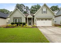 Charming one-story home with well-maintained lawn and a two car garage, with updated siding and trim at 3491 Amerigo Dr, Buford, GA 30519