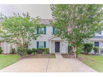 Inviting two-story home with green shutters and a large parking pad at 257 Turnstone Rd, Stockbridge, GA 30281