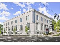 Modern condominium building featuring an attractive architectural design and professional landscaping at 108 Park Place Unit 107, Decatur, GA 30030