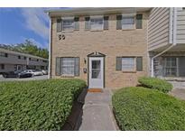 Charming brick townhouse featuring neat shrubbery and a welcoming front door at 4701 Flat Shoals Rd # 50A, Union City, GA 30291