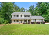 Charming two-story home with manicured lawn and lovely landscaping in a desirable neighborhood at 2750 Briarfield Way, Lawrenceville, GA 30043