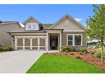 Charming single-Gathering home featuring a well-maintained lawn and a welcoming two-car garage at 2012 Ripple Park Bend, Canton, GA 30114