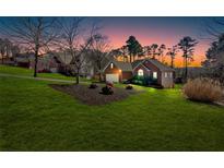 Charming single Gathering home with lush lawn and landscaping situated on a landscaped lot at 46 Centerport Dr, White, GA 30184