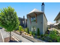Modern two-story home featuring a unique architectural design, landscaped yard, and beautiful curb appeal at 260 2Nd St, Fayetteville, GA 30214