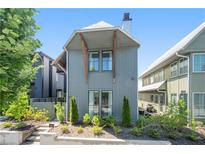 Modern two-story home featuring minimalist landscaping and contemporary architectural details at 260 2Nd St, Fayetteville, GA 30214