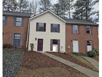Charming townhome with a two-story facade, neutral siding, and classic shutters at 6002 Pat Mell Se Pl, Smyrna, GA 30080