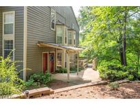 View of the exterior with a covered front porch and well-maintained landscaping at 607 Riverview Se Dr # 607, Marietta, GA 30067