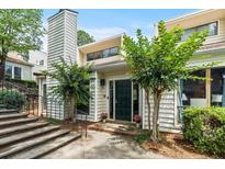 Inviting exterior of a two-story home with a charming front door and well-manicured landscaping at 663 Serramonte Dr, Marietta, GA 30068