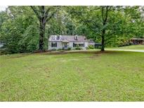 Charming one-story home surrounded by lush greenery, offering a peaceful retreat at 1774 Willis Mill Rd, Atlanta, GA 30311