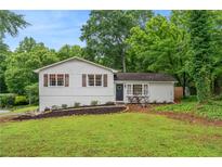 Charming single-story home featuring a well-manicured lawn and tasteful landscaping, offering excellent curb appeal at 4120 Valley Wood Nw Dr, Marietta, GA 30064