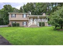 Charming two-story home featuring a welcoming front porch and a well-manicured front yard at 123 Mill Ln, Dallas, GA 30157