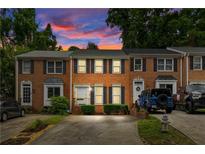 Charming brick townhomes with well-maintained landscaping and individual driveways at 2779 Bentley Se Pl, Marietta, GA 30067