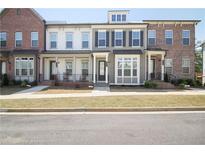 Charming townhome with varied facades, inviting entrances, and well-manicured front lawns at 3313 Park Pointe Cir, Scottdale, GA 30079