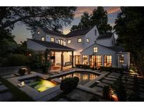 Stunning backyard oasis with a sparkling pool, spa, and lush landscaping, perfect for outdoor entertaining at 820 Highland Ne Ter, Atlanta, GA 30306