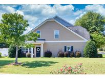 Charming home featuring manicured lawn and tasteful landscaping, creating inviting curb appeal at 240 Orchard Dr, Covington, GA 30014