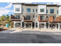 Modern townhome featuring private balconies, attached garages, and neutral-tone exterior at 2333 Mason Dr # D26, Atlanta, GA 30316