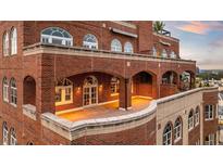 Spacious outdoor patio with brick archways and rooftop access at 3180 Mathieson Ne Dr # 1401, Atlanta, GA 30305
