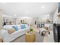 Bright living room features an open layout, white sofa, and stylish decor at 2151 Zelda Ne Dr, Atlanta, GA 30345