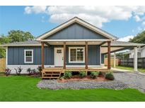 Charming craftsman-style home features a welcoming front porch and manicured lawn at 598 Taylor Se Dr, Smyrna, GA 30080