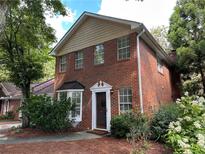 Charming two-story brick home with manicured landscaping and a welcoming entrance at 101 Swanton Hill Ct, Decatur, GA 30030
