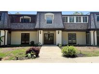 Charming townhome with a symmetrical design and well-maintained landscaping at 125 Rue Fontaine, Lithonia, GA 30038