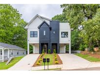 Stunning modern farmhouse-style duplex with black and white siding and meticulously landscaped front yard at 178 Wesley Ne Ave # A, Atlanta, GA 30307