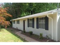 Charming single-story home featuring a well-maintained lawn and classic curb appeal at 4363 Stonewall Tell Rd, Atlanta, GA 30349