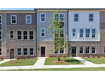 Charming townhomes with brick and siding accents and well-manicured lawns at 2973 Beaconwood Ct, Lawrenceville, GA 30043