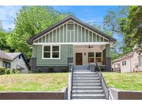 Charming craftsman home with a inviting front porch and stylish green and white exterior at 905 Gaston Sw St, Atlanta, GA 30310