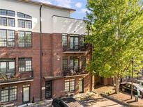 Stylish townhome with brick facade, balconies, and lush landscaping in a desirable location at 1300 Dekalb Ne Ave # 221, Atlanta, GA 30307
