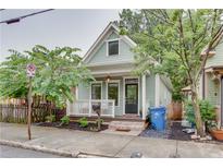 Charming home featuring a quaint front porch, complemented by stylish landscaping at 151 Savannah Se St, Atlanta, GA 30316