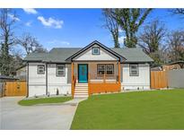 Charming renovated home featuring a welcoming front porch and fresh landscaping at 3470 Glenwood Rd, Decatur, GA 30032