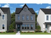 Charming two-story home with vertical siding, a modern roofline, and professionally landscaped front yard at 790 Timbre Ln, Decatur, GA 30033