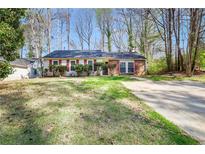Charming ranch home with brick accents and a well-maintained front yard at 5422 Timor Trl, Lithonia, GA 30038