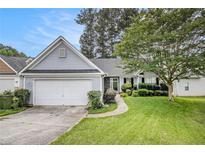 Charming single-story home with a well-maintained lawn, attached garage and inviting curb appeal at 104 Terrapin Ct, Carrollton, GA 30116