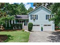 Charming two-story home with a well-manicured lawn, inviting curb appeal, and a two-car garage at 368 Lambeth Dr, Hiram, GA 30141