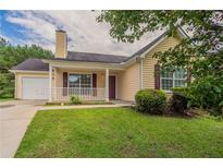 Charming single-Gathering home with a quaint front porch and well-maintained lawn at 3673 Jervis Ct, Rex, GA 30273