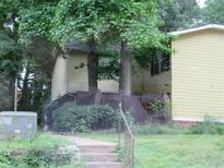 Two-story home with a well-maintained yard and mature trees in a quiet neighborhood at 1993 Whitehall Forest Ct, Atlanta, GA 30316