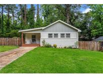 Charming single-story home with a well-maintained lawn, freshly painted exterior, and a welcoming front porch at 1564 Belva Ave, Decatur, GA 30032