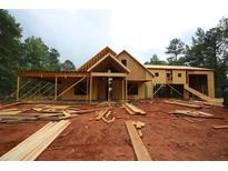 Exterior view of a two-story home under construction, featuring wood framing and a covered porch at 578 Price Rd, Carrollton, GA 30116